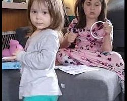 Lyra working on a dream catcher from a kit she has as Luna "helps"