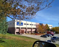 The hospital looks quite beautiful with the fall colors and blue sky!