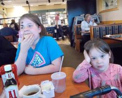 Lyra eats a slice of cantaloupe and Luna looks bored hahaha