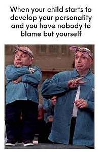 Photo of a dwarfed bald man in an attitude of defiance, arms across chest; a normal-sized man stands next to him, dressed identically in the same posture. Caption: When your child starts to develop your personality and you have no one to blame but yourself.