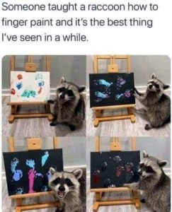 4 photos of a raccoon with happy expressions, standing in various positions to point at painting sitting no an easel next to him. Caption: Someone taught a raccoon how to finger pain and it's the best thing I've seen in a while.