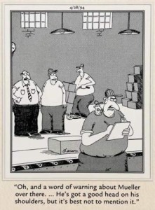 Cartoon of 3 men working on a loading dock, with another man in the foreground holding a clipboard and pencil, who has a miniature of his own head sitting on his right shoulder. Caption: "Oh, and a word of warning about Mueller over there...He's got a good head on his shoulders, but it's best not to mention it."