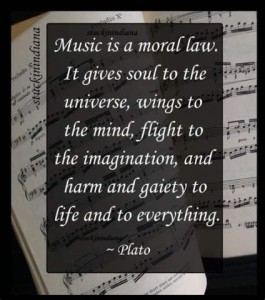 Against a background of a musical score is a quote from Plato: Music is a moral law. It gives soul to the universe, wings to the mind, flight to the imagination, and hard and gaiety to life and to everything.