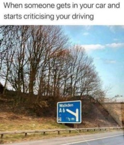 Photo of a roadside sign announcing an upcoming exit to a place called Walkden. Caption: When someone gets in your car and starts criticizing your driving.
