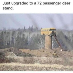 photo of a construction area with piles of dirt in the foreground, and hills in the background. There is a tall pillar with a school bus sitting on the top of it. Caption: Just upgraded to a 72 passenger deer stand.