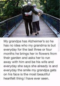 Photo of an elderly couple, taken from behind, as they walk across a bridge with arms around each other. Text below photo. "My grandpa has Alzheimer's so he has no idea who my grandma is but everyday for the last three or four months he brings her in flowers from their garden and asks her to run away with him and be his wife and everyday she says she already is and everyday the smile my grandpa gets on his face is the most beautiful heartfelt thing I have ever seen.
