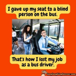 Photo of a man driving a bus; there is a woman standing next to him looking at her phone in her hand, and other people further back in the bus. Caption: I gave up my seat to a blind person on the bus. That's how I lost my job as a bus driver.