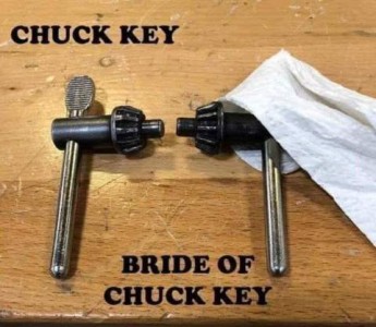 Photo of two chuck keys. The one on the left is labeled "chuck key". The one on the right, facing the other one, has a piece of paper towel covering the top and back of the "head" and is labeled "Bride of Chuck Key"