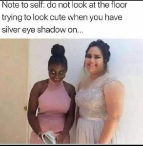 Two young women posed for a photo in formal dresses, both smiling for the camera. The one on the left appears to have glowing eyeballs. Caption: Note to self - do not look at the floor trying to look cute when you have silver eye shadow on.