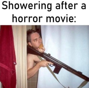 A wet man, peeking out from behind a shower curtain, holding the sponge over his mouth in one hand and a rifle in the other. Caption: Showering after a horror movie.