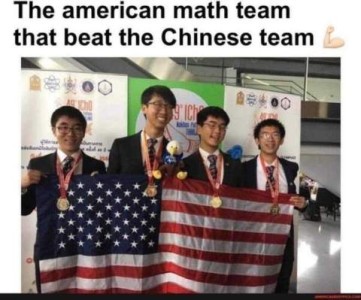 photo of 4 asian young men smiling and holding up a US flag. Caption: The Amerian math team that beat the Chinese team.