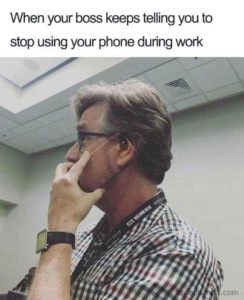 Profile photo of a man talking on the phone; the back of his phone is a photo of his ear and cheek, what would be showing if the phone wasn't there. Caption: When your boss keeps telling you to stop using your phone during work