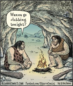 cartoon of 2 cave men sitting around a fire in a cave. One says, "Wanna go clubbing tonight?"