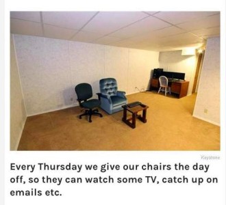 Photo of a mostly empty room in a basement. In the center is a small end table, with an upholstered chair and an office chair facing it. Text: Every Thursday we give our chairs the day off, so they can watch TV, catch up on emails, etc.