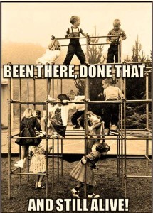 Vintage photo of about a dozen young children playing on a very tall metal set of monkey bars. Caption: Been there, done that, and still alive.