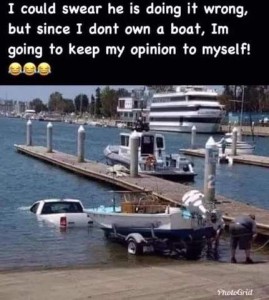A dock scene on the ocean showing a cruise ship and a couple of other boats at docks, plus a truck pulling a trailered boat into the water - forward; the truck is almost complete submersed. Caption: I could swear he is doing it wrong, but since I don't own a boat, I'm going to keep my opinion to myself!