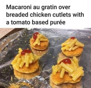 Title: Macaroni au gratin over breaded chicken cutlets with a tomato based puree. Photo of 4 chicken nuggets with some macaroni and cheese on top, and a squirt of ketchup over it.