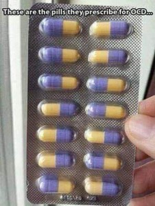 Photo of a card of 14 purple and yellow capsules, facing in different directions. Caption: These are the pills they prescribe for OCD