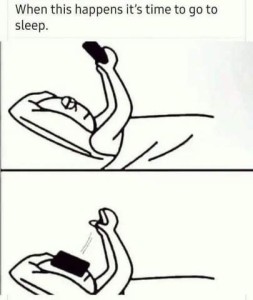 2 black and white drawings. Top drawing shows someone laying on his back in bed, holding his cell phone up in the air, looking at the screen; bottom shows same picture but with hands empty and phone on his face. Caption: When this happens it's time to go to sleep.