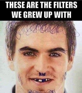 Title: These are the filters we grew up with. Photo of a man's face that has been altered with a pen, adding extra hair, longer eyebrows and lashes, a tiny mustache, whiskers, and beard.