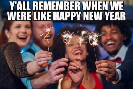 Photo of 4 people celebrating with little sparklers that spell out 2020. Caption: Y'll remember when we were like, Happy New Year!