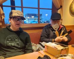 Pete starts opening his gifts as Leelan watches. This is a BBQ multitool.