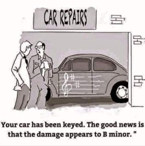 Cartoon at a car repair shop. Mechanic is talking to customer about his VW bug that has a musical staff with a treble clef and 2 sharps on the side. Mechanic is saying, "Your car has been keyed. The good news is that the damage appears to B minor."