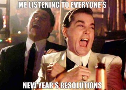 Photo of two men, dressed up in suits, in a nightclub (or similar) setting, laughing. Caption: Me listening to everyone's new year's resolutions.