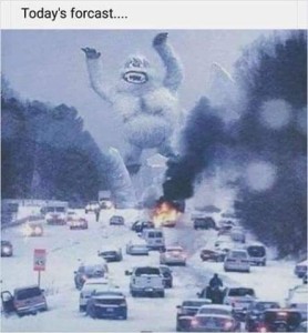 Photo of a big pileup of cars on a snowy road; ahead of them is the old cartoon Abominable Snowman facing the chaos and destruction, arms raised.
