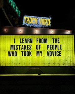 Sign in front of a truck yard: "I learn from the mistakes of people who took my advice."