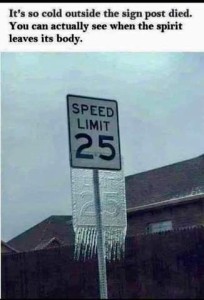 Photo of a sign: SPEED LIMIT 25 There is a thin sheet of ice that had been coating the raised characters on the sign, now sliding off below it; there are shadows where the words/numbers were, and icicles hanging off the bottom. Caption: It's so cold outside the sign post died. You can actually see when the spirit leaves its body.
