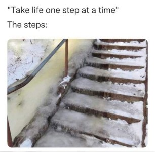"Take life one step at a time." The steps: Photo of concrete stairs covered with snow and ice.