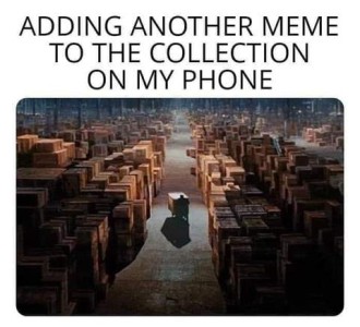 Photo of a person moving a big box through an aisle of a MASSIVE warehouse, so big that the person appears tiny as he moves away from the camera. Caption: Adding another meme to the collection on my phones.