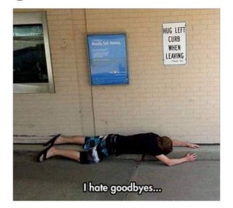 Photo of a man at a bank drivethrough, laying on the curb next to the building, arms above his head, as if pressing himself against it. There is a sign above him that says, "Hug left curb when leaving." Caption: I hate goodbyes...