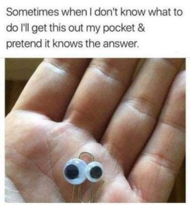 Photo of a hand holding a paper clip in its palm, the paper clip has a mismatched pair of googly eyes affixed to it. Caption: Sometimes when I don't know what to do I'll get this out of my pocket & pretend it knows the answer.