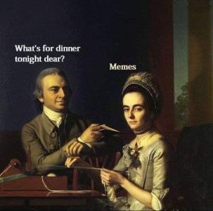 Photo of a couple in Elizabethan clothing sitting at a table. The man is asking the wife, "What's for dinner tonight, dear?" She is looking toward the person viewing the picture as she replies, "memes"