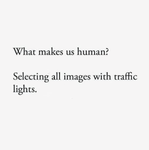 Text only: What makes us human? Selecting all images with traffic lights.
