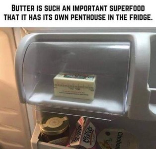 Photo of the butter compartment on the inside of a refrigerator door. Caption: Butter is such an important superfood that it has its own compartment in the fridge.