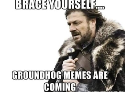 Photo of a man in arctic fur coat speaking into a microphone: Brace yourself...groundhog memes are coming.