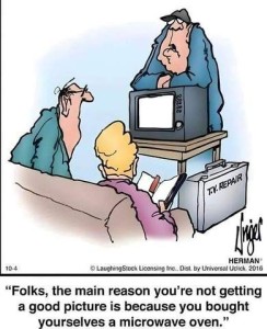 Cartoon; an elderly couple is sitting on a davenport; across from them is their television set with a TV repairman standing behind it; he is telling them, "Folks, the main reason you're not getting a good picture is because you bought yourselves a microwave oven."